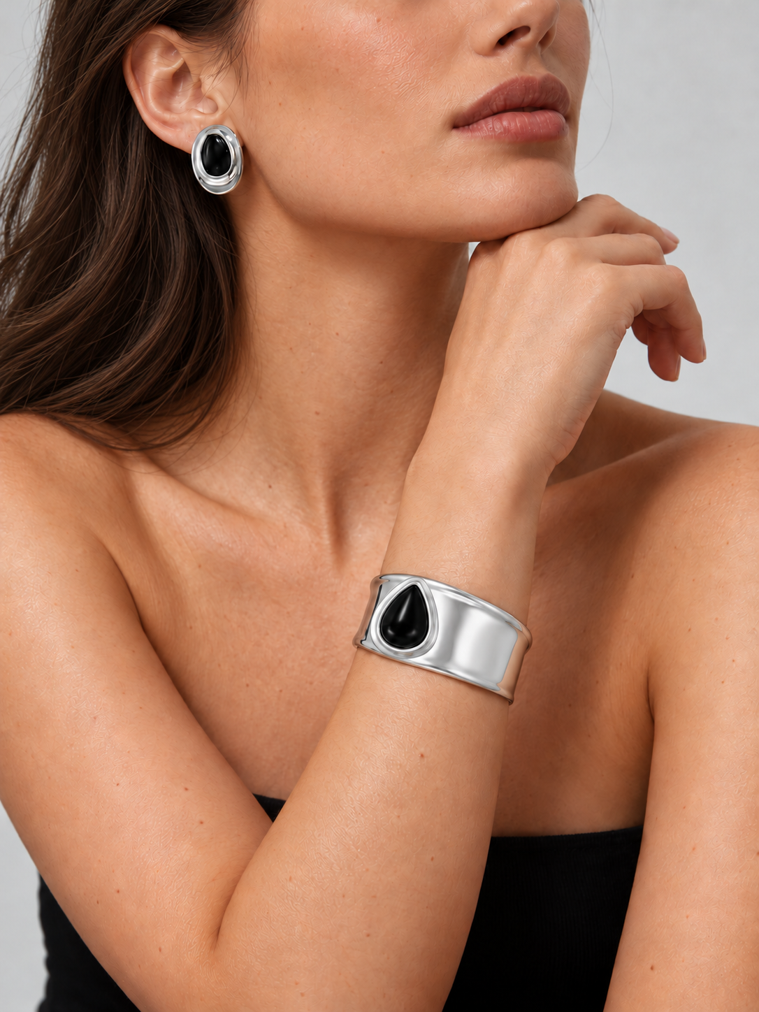 The Noir Set by Mercer Street: silver-tone black onyx earrings and matching cuff bracelet worn together